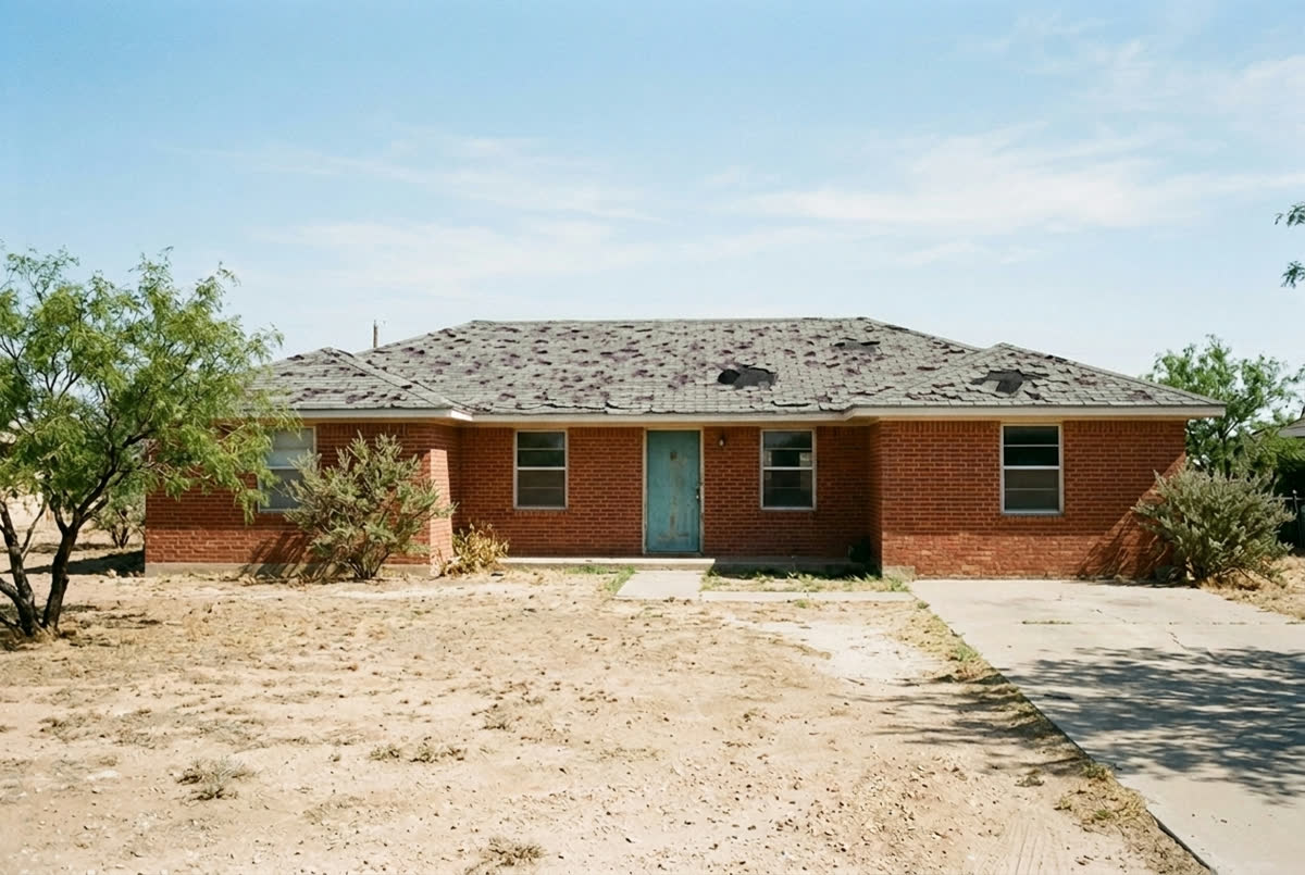 Sample photo: a brick ranch house with a hail-beaten shingle roof.