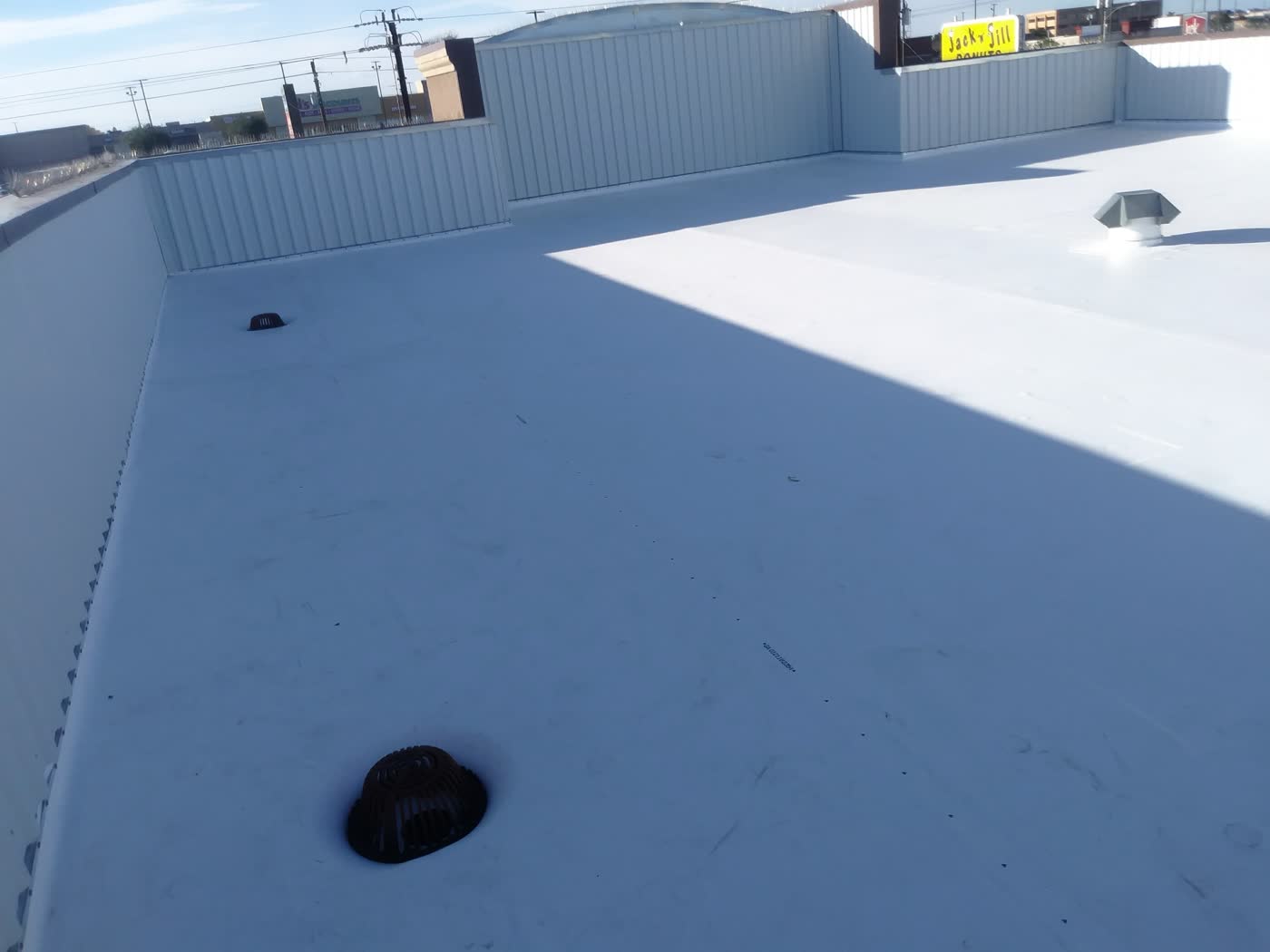 A finished white TPO roof on a commercial building.